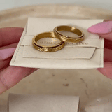 gold spinning cross pattern ring