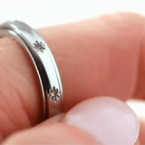 silver spinning star eternity band ring