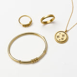 essentials 4-bead bangle - gold