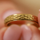 gold spinning cross pattern ring